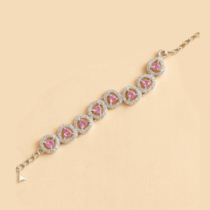 Silver bracelet featuring pink heart-shaped stones surrounded by American Diamonds in a circular halo design.