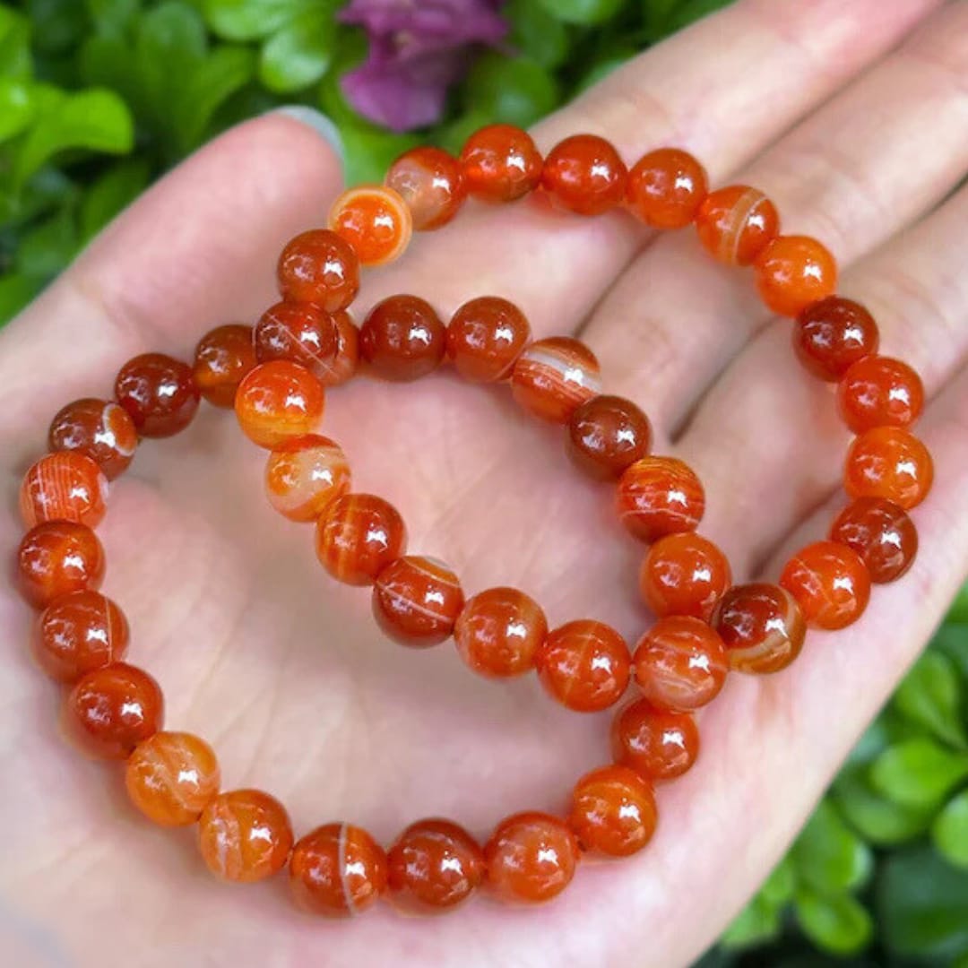 AdiShakti Carnelian Bracelet featuring vibrant natural Carnelian beads, designed for unisex spiritual healing, energy boost, and creativity.