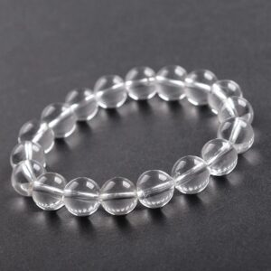 AdiShakti Clear Quartz Bracelet with natural transparent stones, designed for unisex energy healing, clarity, and spiritual cleansing.