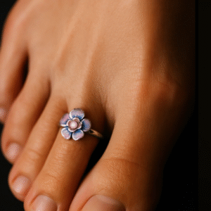 Purple enamel floral 925 silver toe ring (bichhiya) worn on the second toe, styled on a bare foot.