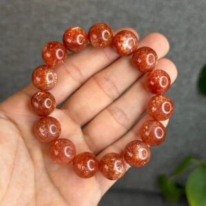 AdiShakti Sunstone Bracelet with warm orange-gold natural stones, designed for unisex empowerment, joy, vitality, and solar plexus healing.