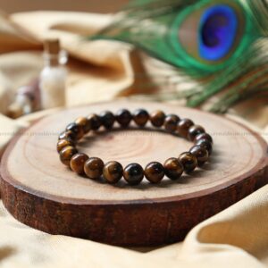 AdiShakti Tiger Eye Bracelet featuring polished golden-brown natural stones, designed for unisex grounding, focus, protection, and solar plexus healing.